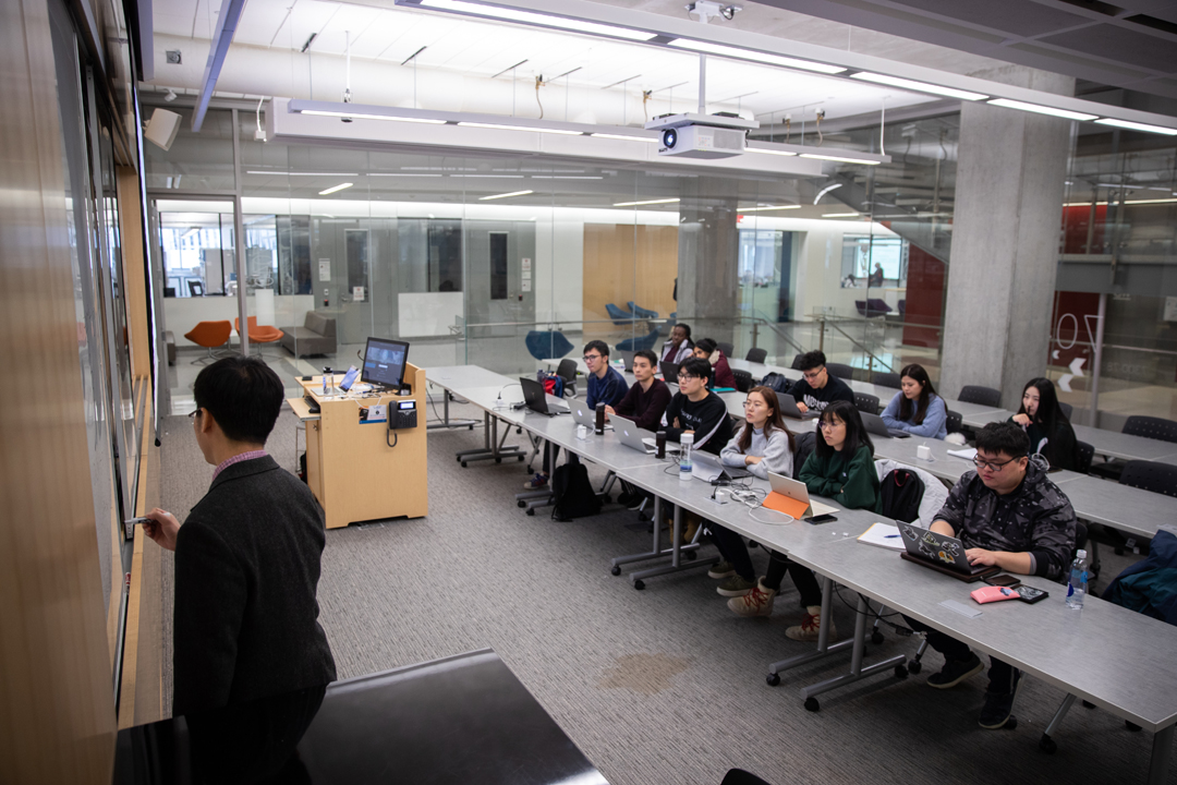 A professor teaching a data science class in the science and engineering hall